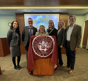 RPPTL members at a podium bearing the Section seal